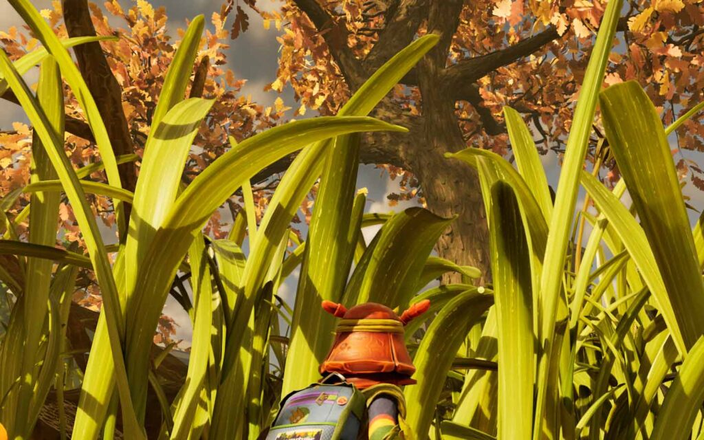 A player looking through the grass up at the large oak tree.